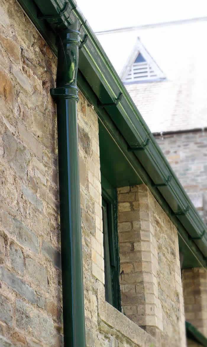 Heritage buildings with cast iron gutters, downpipes and hopper heads