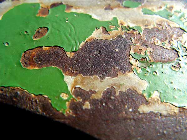 Peeling paint on cast iron gutter