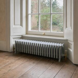 Victorian four-column cast iron radiator, 353mm high, in primer, in a period room.