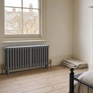 Victorian four-column cast iron radiator, 485mm high, in primer, in a period room.