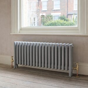 Victorian four-column cast iron radiator, 636mm high, in primer, in a period room.