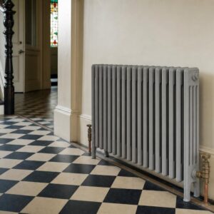 Victorian four-column cast iron radiator, 785mm high, in primer, in a period room.