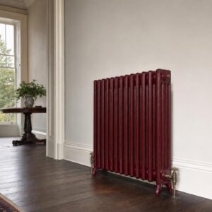 Victorian four-column cast iron radiator, 935mm high, factory painted, in a period room.
