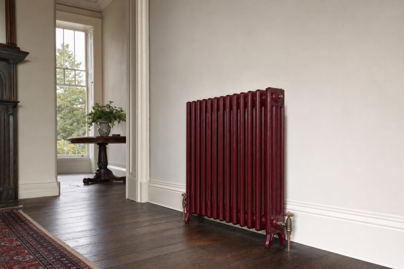 Victorian four-column cast iron radiator, 935mm high, factory painted, in a period room.