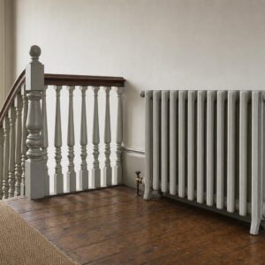 Victorian four-column cast iron radiator, 935mm high, in primer, in a period room.