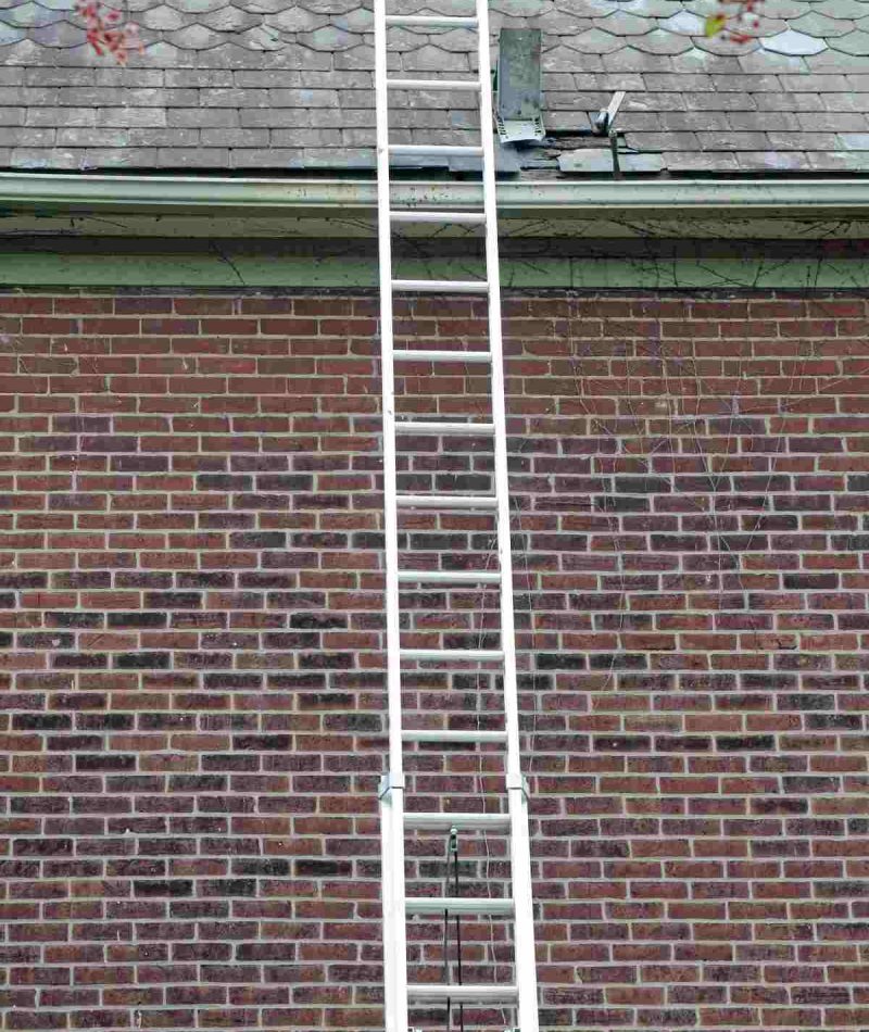 Ladder-again-slate-roof_cast-iron-gutter-repairs_cherry-picker-services